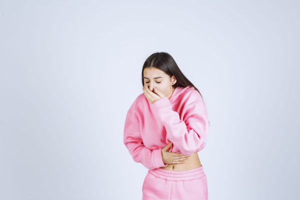 Girl is coughing or vomiting because of pregnancy Girl is coughing or vomiting because of pregnancy. High quality photo